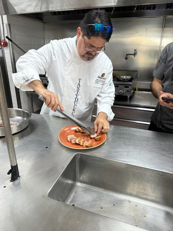 Chef Benjamin Nava Vargas, a renowned chef in Mexico, plates sliced duck breast from a Jurgielewicz & Son Pekin duck. Jurgielewicz recently hired Chef Benjamin as an ambassador to expand into the tourism and upscale restaurant industry in Mexico.