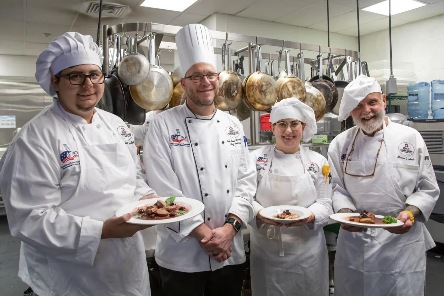 HACC culinary arts students, from the left, Jacob Fedetz, Angelika Tayac and Michael Hosta, along with Chef Chad Brumbaugh (second from left) recently participated in a demonstration on how to prepare Pekin duck with representatives from Joe Jurgielewicz & Son on Sept. 5.